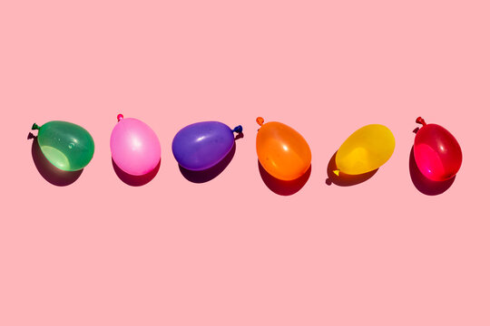 Studio shot of row of colorful water balloons