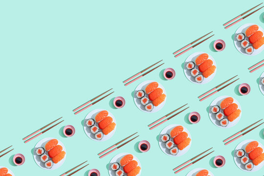 Pattern of plates of sushi against green background