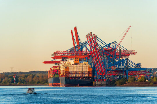 Container ship and gantry crane at Hamburg harbor terminal