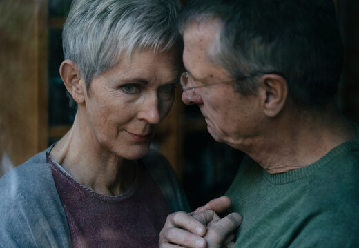 Senior man consoling sad wife
