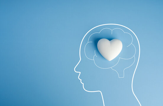Mental health concept. Human head outline with heart inside brain. Emotional wellbeing, self care, psychological support, emotional intelligence, mindfulness, compassion, and holistic mental wellness.