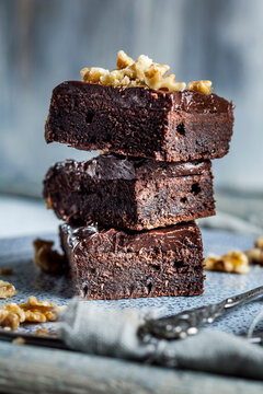 Stack of homemade gluten free brownies with chocolate and coffee glazing