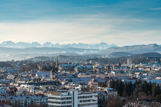 Switzerland, Zurich, City with snow covered mountains in background, aerial view