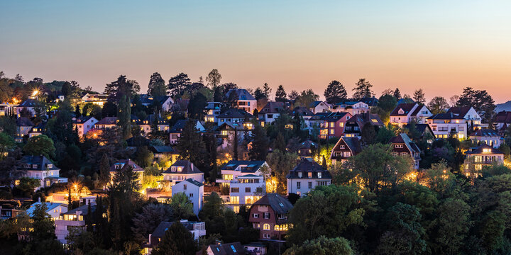 Germany, Baden-Wurttemberg, Stuttgart, Clear sky over wooded residential district at dusk