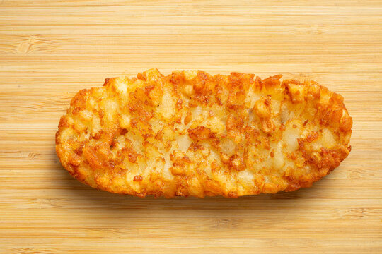 A top down view of a hash brown patty.