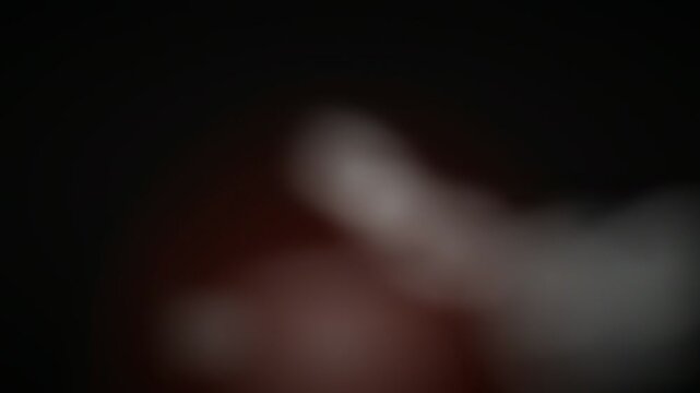 Moody atmospheric grey black smoke plumes drifting upward over dark volcanic red glow