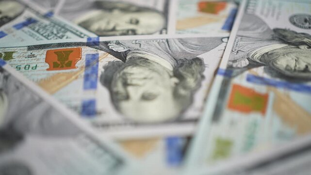 Large amount of 100 US dollar bills lying together. Financial concept of banking, investment, cash flow and big money earnings in business
