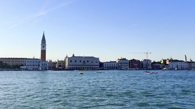 Afternoon view of Doge's Palace and Piazza San Marco in Venice, Italy. Smooth camera movement highlighting the historic Gothic architecture in daylight.