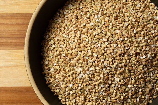A top down view of a bowl of whole grain buckwheat.