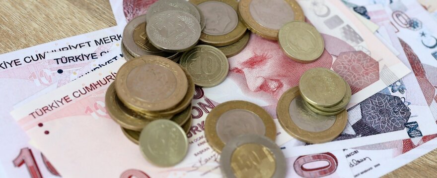 Turkish lira money bills and coins on table. Turkey cash of TRY currency close up
