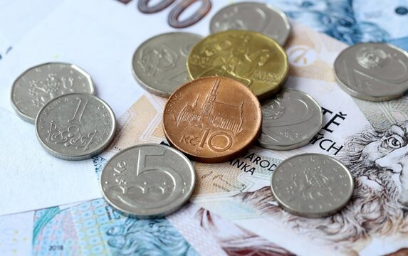 Czech koruna money bills and coins on table. Czech Republic cash of CZK currency close up