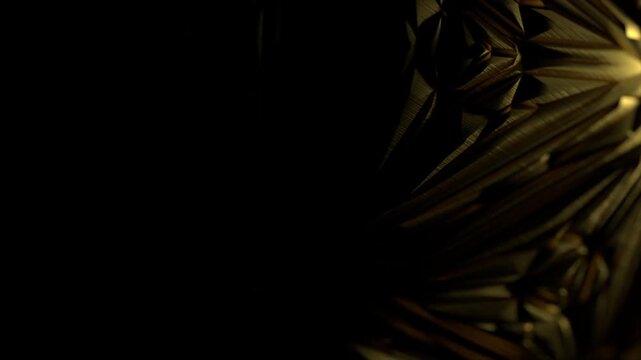Golden facets catch light, creating sharp, radiant geometry. Deep shadows contrast with bright highlights, adding depth and drama. Surface appears smooth yet complex, with intricate, angular patterns