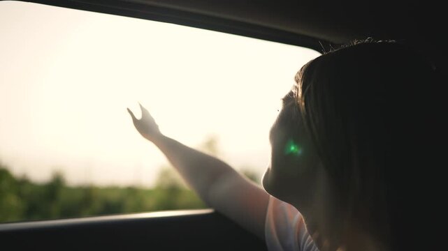Woman embraces tourism hand out car window. touches air feeling free on journey. Tourism freedom woman at window. Woman enjoys drive reaching through window. Tourism experience with woman hand window.
