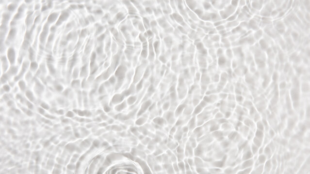 Top view of waterdrop dropping on a surface of water