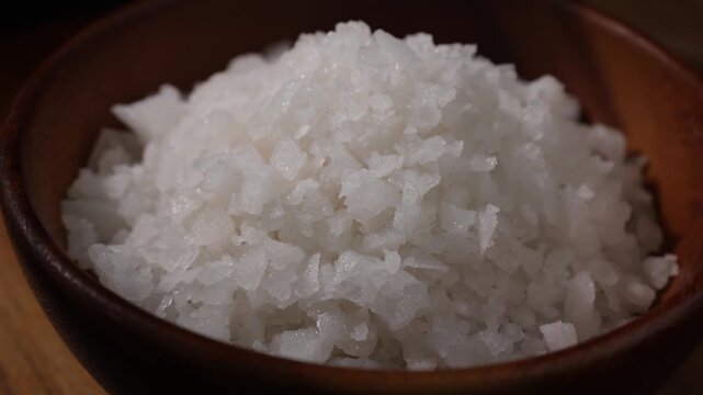 Dolly Shot of Natural Sea Salt in a Wooden Bowl