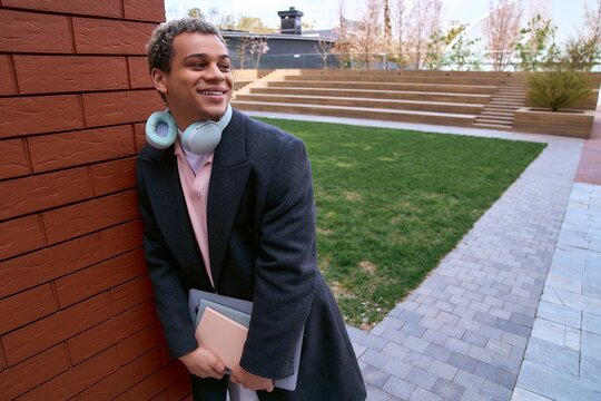 Handsome young African American student enjoying a stylish day in the city