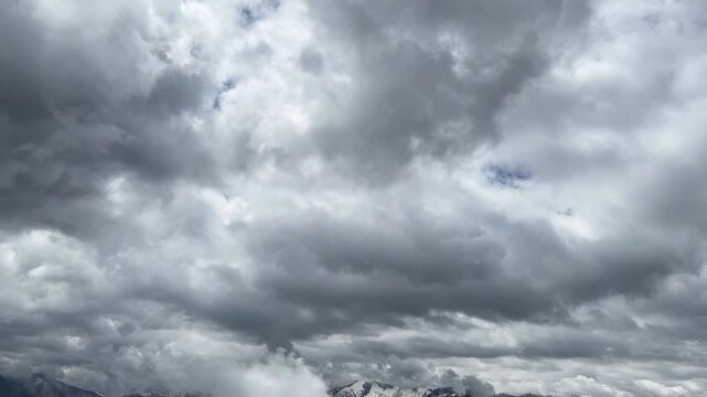 Dramatic Timelapse of Fast-Moving Clouds Over the Majestic Austrian Alps in Summer
