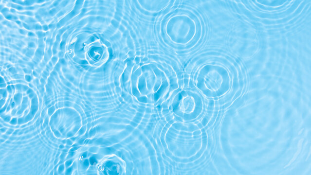 Top view of waterdrop dropping on a surface of water