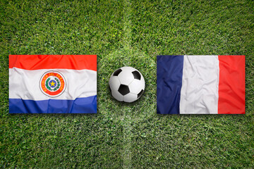 Paraguay vs. France flags on a soccer field © BirgitKorber