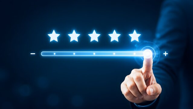 Businessman adjusting a digital slider to five stars representing maximum customer satisfaction premium quality and excellent service