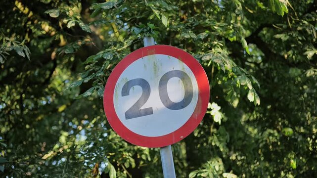 Cutaway shot. 20 mph speed limit, speed limit sign. 
