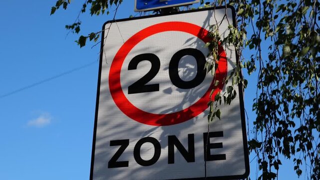 Cutaway shot. 20 mph speed limit, speed limit sign. 