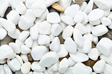 White pebble stones as background, top view © Liami