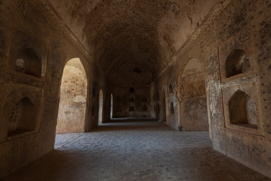 View of the historic interior chambers with arched alcoves and stone vaulted ceilings at Kot Diji Fort in Kot Diji, Sindh, Pakistan.