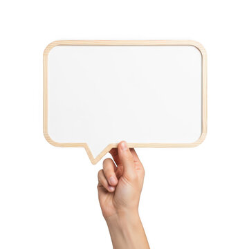 A hand holding a blank wooden speech bubble sign for communication