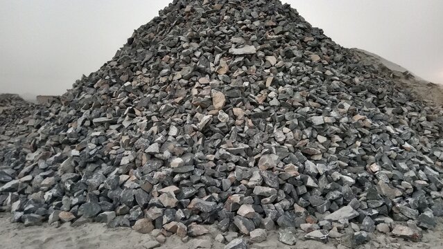 pile of black stones, Huge Mound of Crushed Gray Stones in a Quarry