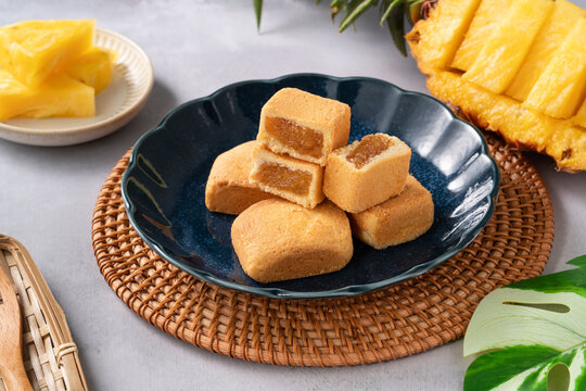 Traditional Taiwanese pineapple cake pastry served on ceramic plate.