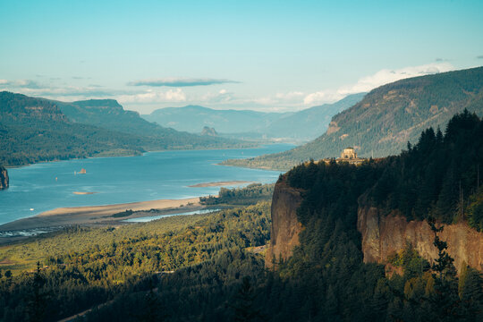 Columbia River Gorge with historic Vista House in golden evening light at sunset, Oregon, Pacific Northwest, USA