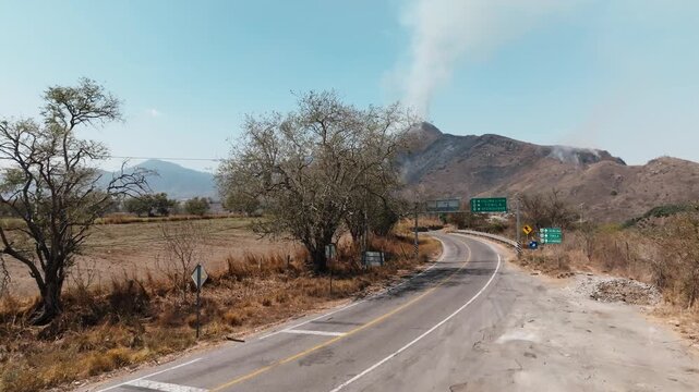 Wildfire Occurring On A Mountain near Tuxpan, Jalisco, Mexico - Drone Shot