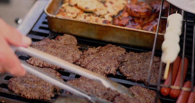 4th of July Barbecue Black Grill Cooking Grilling Meat Chicken Beef Hamburgers Hot Dogs Onions in Celebration of America USA 250th Birthday - in Cinema 4K 30fps Slowed From 120fps