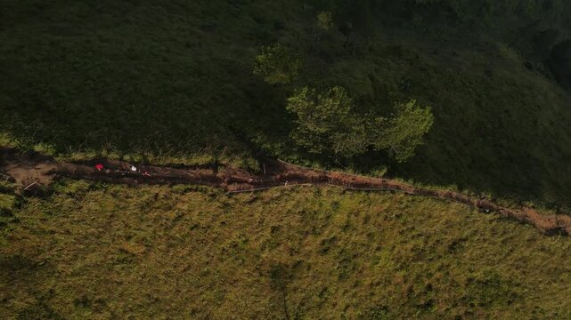 Aerial view of the Mount Andong climbing route via the Temu Kidul Basecamp. Drone footage of hiking trail in Central Java, Indonesia.