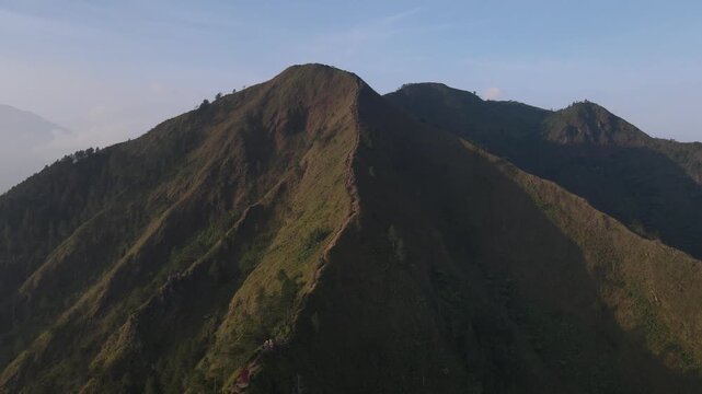 Aerial view of the Mount Andong climbing route via the Temu Kidul Basecamp. Drone footage of hiking trail in Central Java, Indonesia.