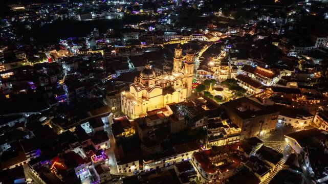 Aerial Orbit Hyperlapse Ascending Shot of the Santa Prisca Parish Church in Taxco, Mexico, at Night