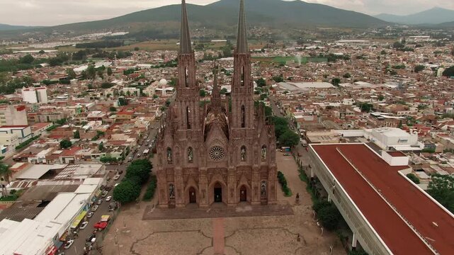 Approaching aerial shot overlooking Sacred Heart Expiatory temple in Zamora de Hidalgo, Mexico