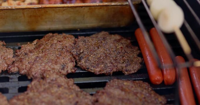 Beautiful pan over 4th of July Barbecue Cooking Grilling Meat Chicken Beef Hot Dogs Onions in Celebration of America USA 250th Birthday - in Cinema 4K 30fps Slowed From 120fps