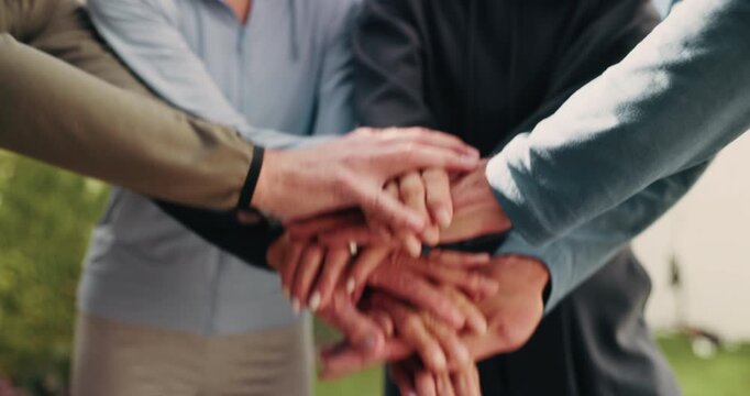 People, unity and hands together in backyard for fitness, exercise or outdoor mission with trust. Health, active group or piling with stack, synergy or community in huddle for wellness or teamwork