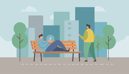 Obraz premium Man sitting on a park bench and using his smartphone while another person walks by with city skyline background.