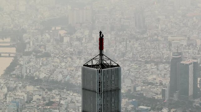 A man climbed to the top of Vietnam's tallest building, Landmark 81 , Ho Chi Minh City - Viet Nam