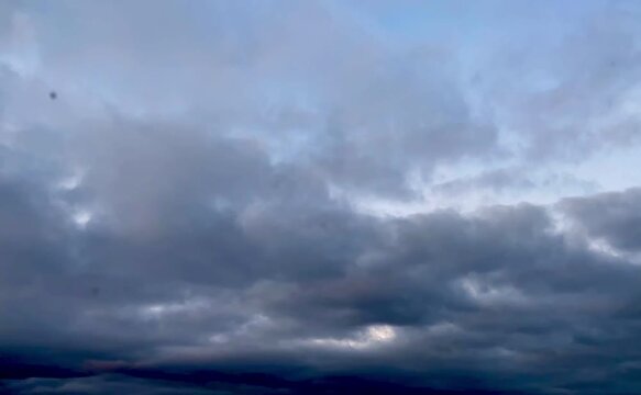 Time-lapse clouds, grey storm stormy dusk, grey clouds, cloud video, cloudscape rolling towards camera