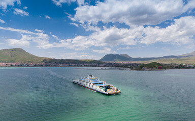 Fototapeta premium Aerial View of Tatvan City Center on the Shores of Lake Van in Bitlis, Turkiye – Urban Landscape Between Mountains and Water