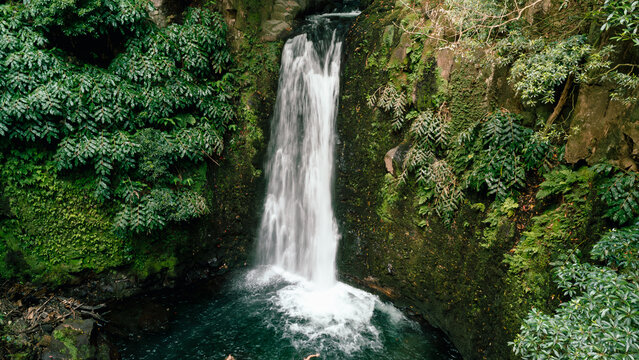 Salto do prego waterfall flowing into a green pool