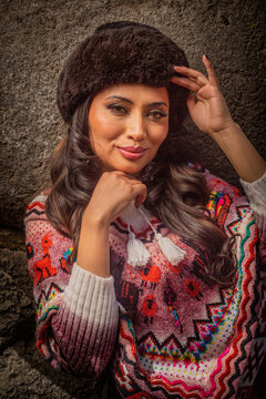 Andean woman wearing handmade Peruvian knitwear in Cusco