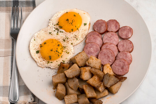 fried eggs with kielbasa  and home fries