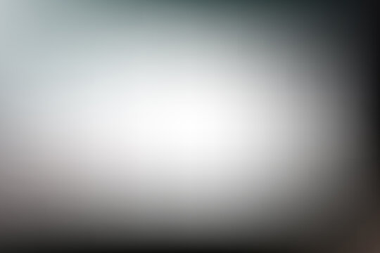 Smooth abstract grey gradient background with soft white center glow