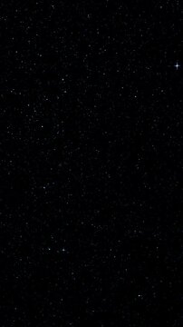 Starfield night sky. Dark space background with twinkling stars and subtle particle motion. Ideal for cosmic, space and atmospheric backgrounds. 