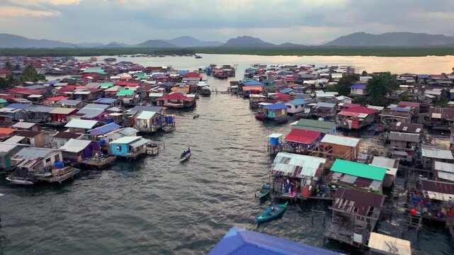Traditional Bajau Laut Village, Sea Gypsy people in Semporna, Borneo, Malaysia. Stilt Houses Above Sea Waters